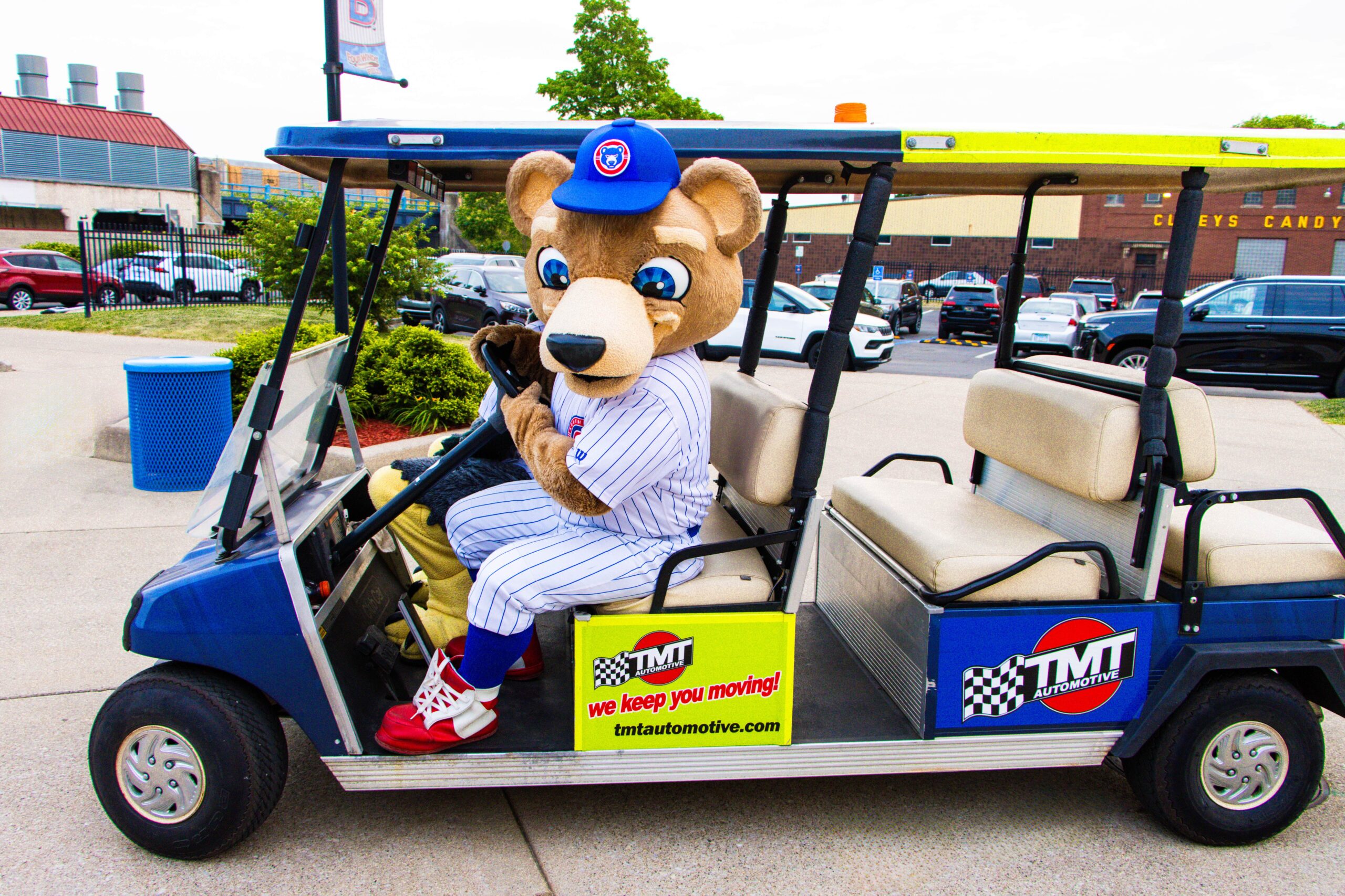 South Bend Cubs mascot on TMT Automotive sponsored golf cart
